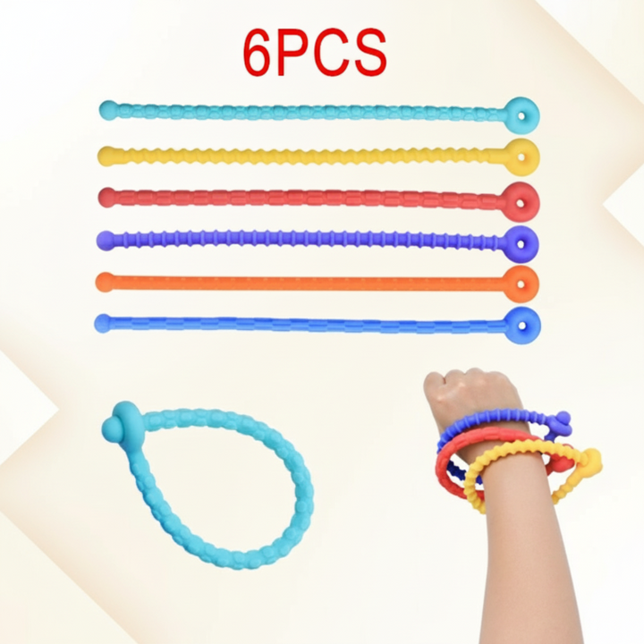 Six colorful textured silicone bracelet strips, shown straight and fastened around a wrist