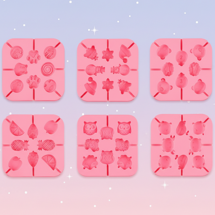 Six pink silicone lollipop molds with animal, fruit, and Christmas designs
