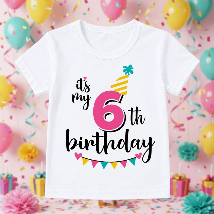 White sixth-birthday T-shirt with a pink number 6, yellow party hat, and colorful bunting