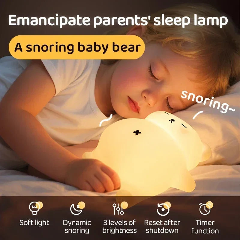 Child resting beside a glowing bear night light with brightness and sound features illustrated