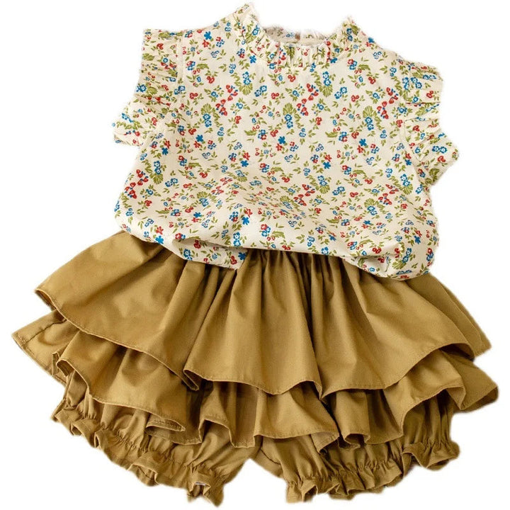 Full view of the floral top and tiered skirt on a white background