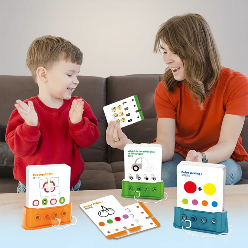 A child and an adult playing with orange, green and blue puzzle boards and activity cards.
