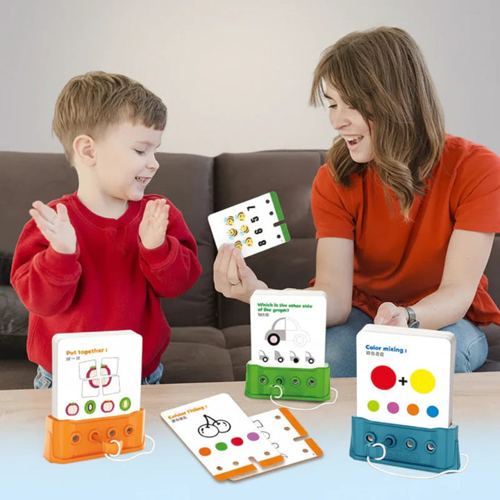 A child and an adult playing with orange, green and blue puzzle boards and activity cards.