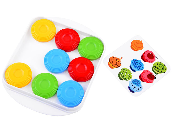 White puzzle board with red, blue, green, and yellow disks beside a pattern card