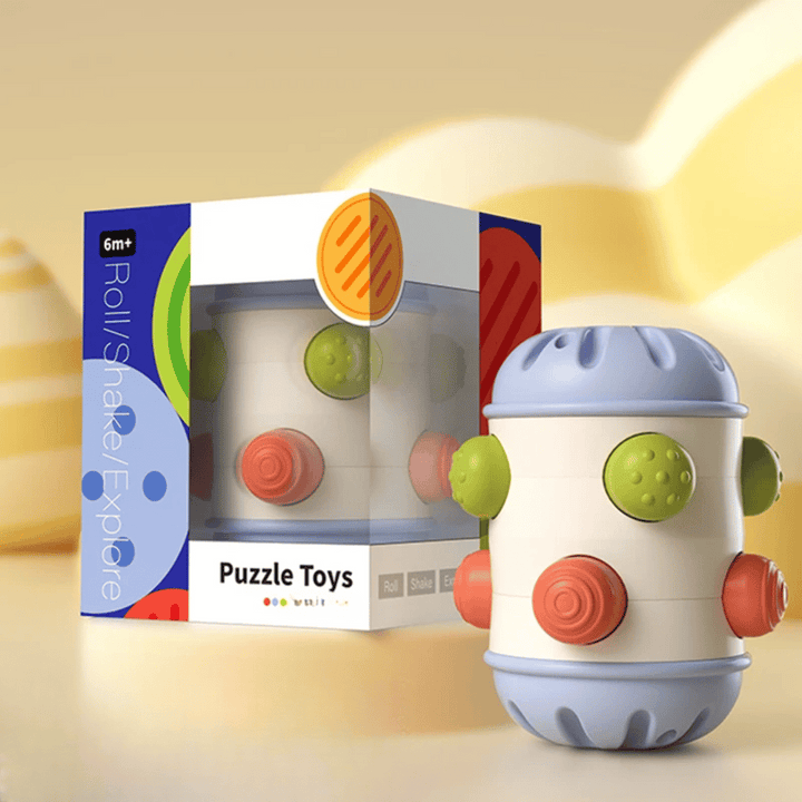 Small blue-ended sensory roller with multicolored textured buttons beside its box