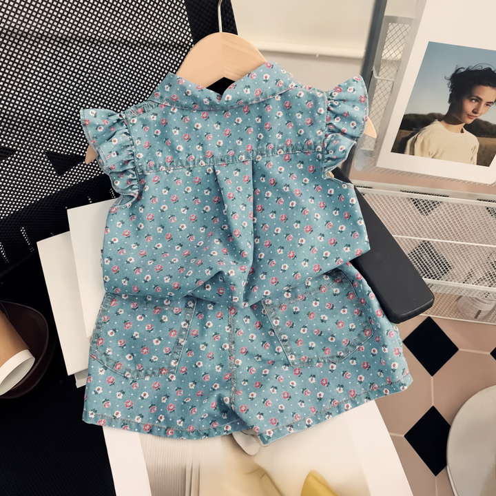 Small-floral blue button-front top and matching shorts displayed on a hanger