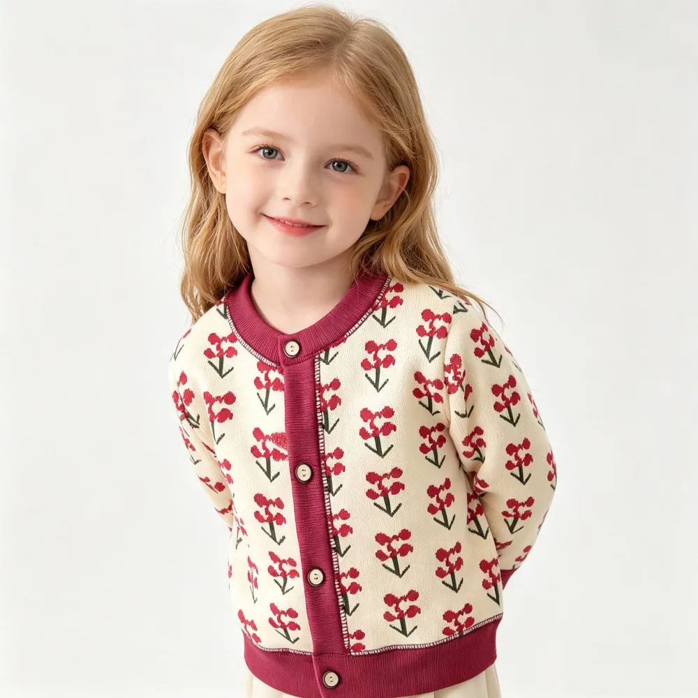 Cream cardigan with small red flowers, burgundy ribbed trim, and a button front