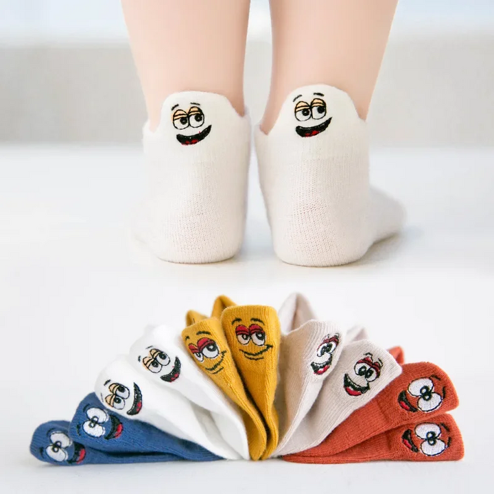 Smiley sock set with five colors and white socks shown from the back