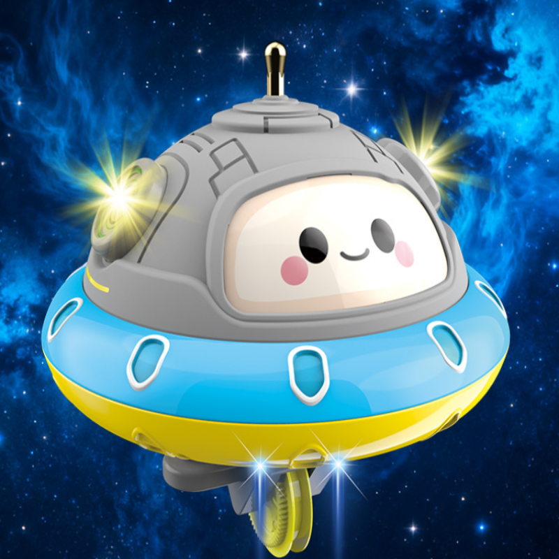 Blue, yellow, and gray UFO balance toy with a smiling face against a starry background.