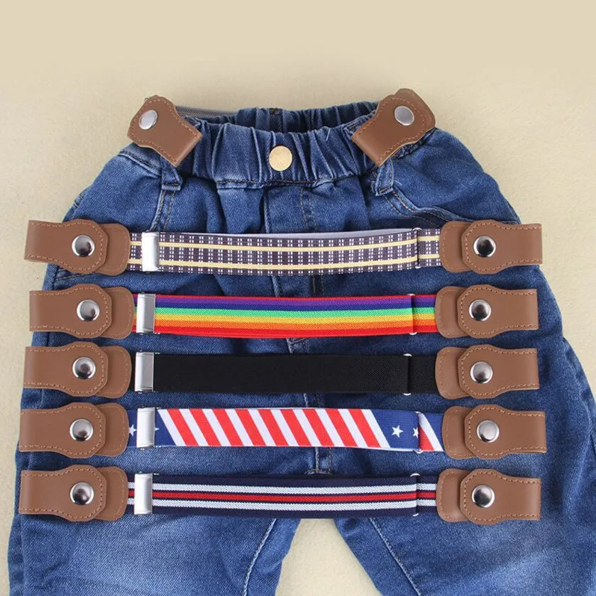 Kids' elastic belts in plaid, rainbow, black and striped designs displayed on blue jeans