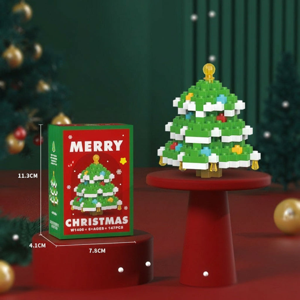 Green Christmas tree block model with snow details and a gold-colored topper