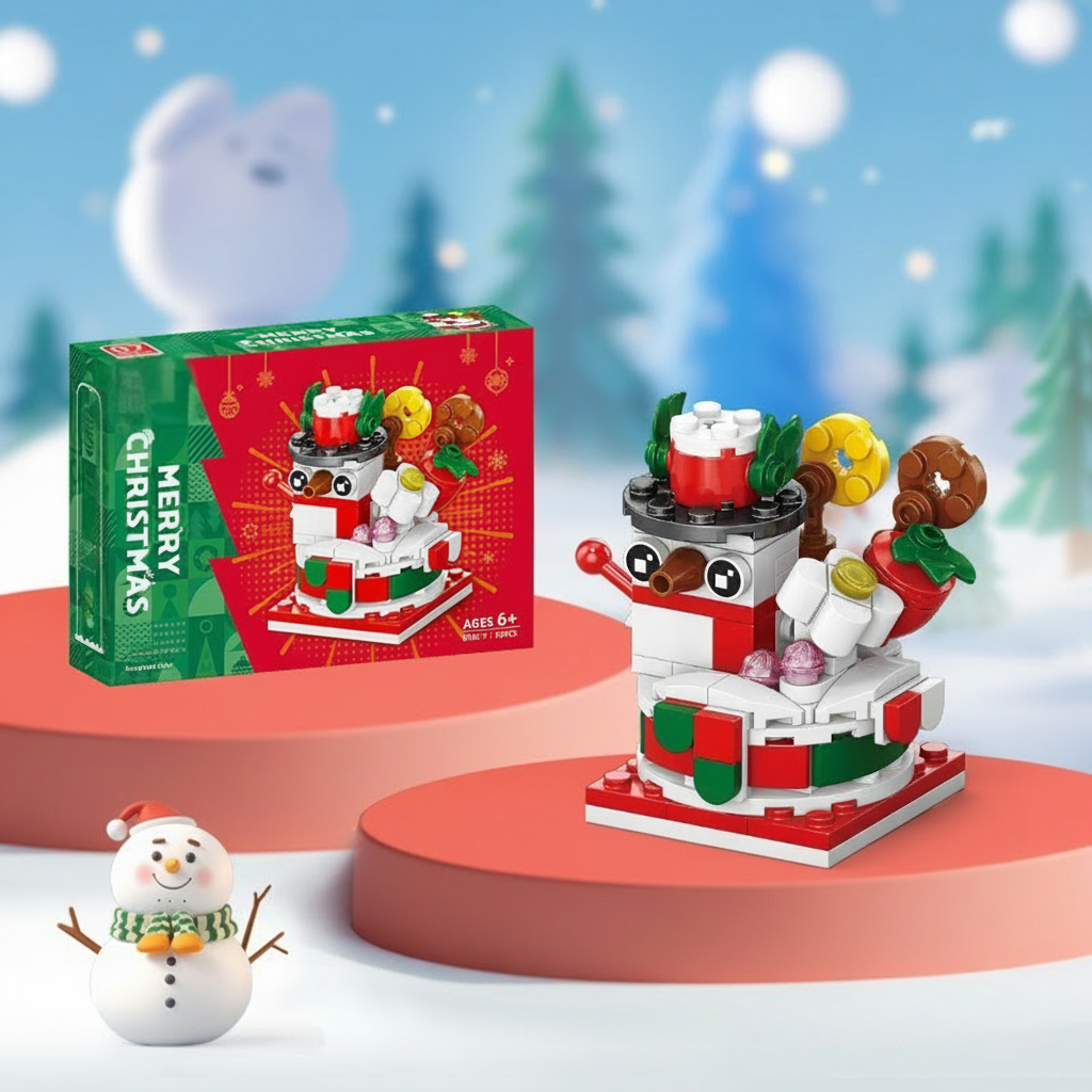 Snowman building model with a black hat and a red and green base beside its box