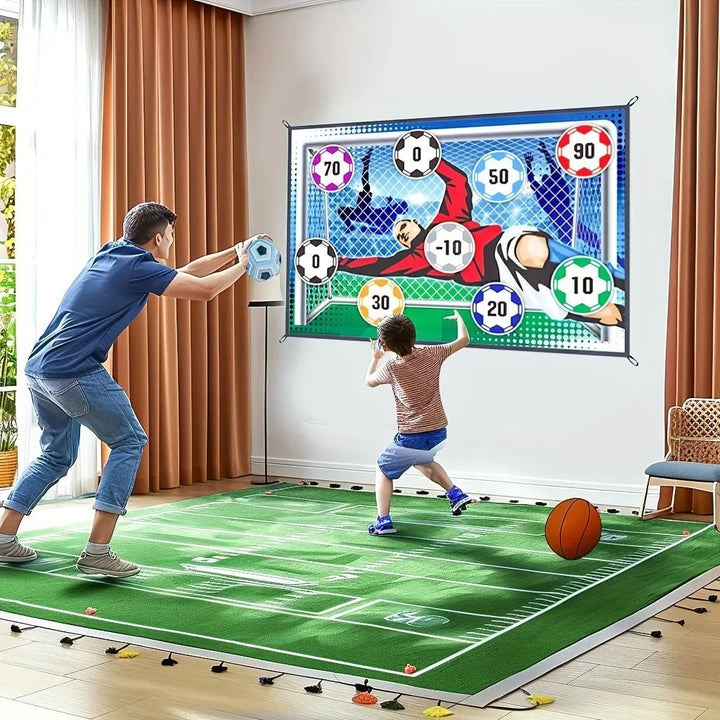 Adult and child playing with a wall-mounted soccer target in a living room