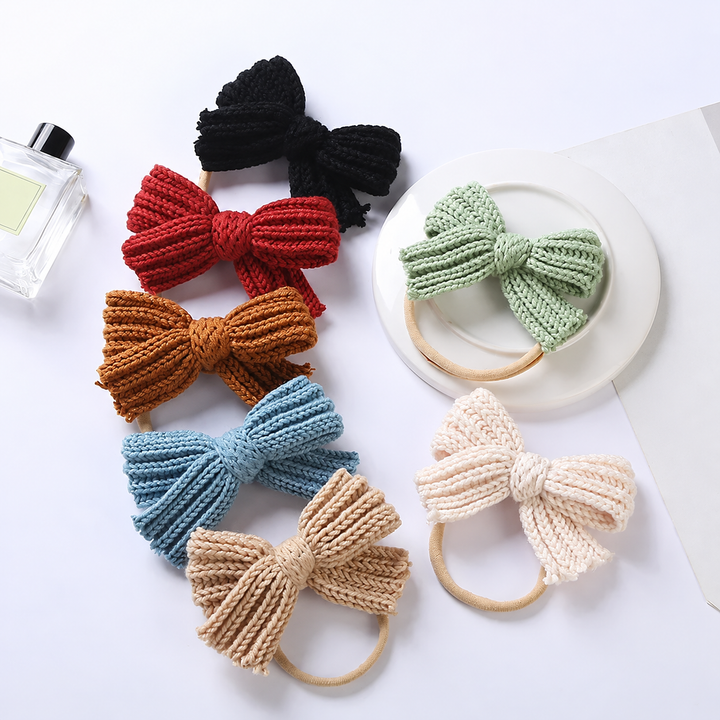 Assorted solid-color knitted bow headbands with slim beige stretch bands