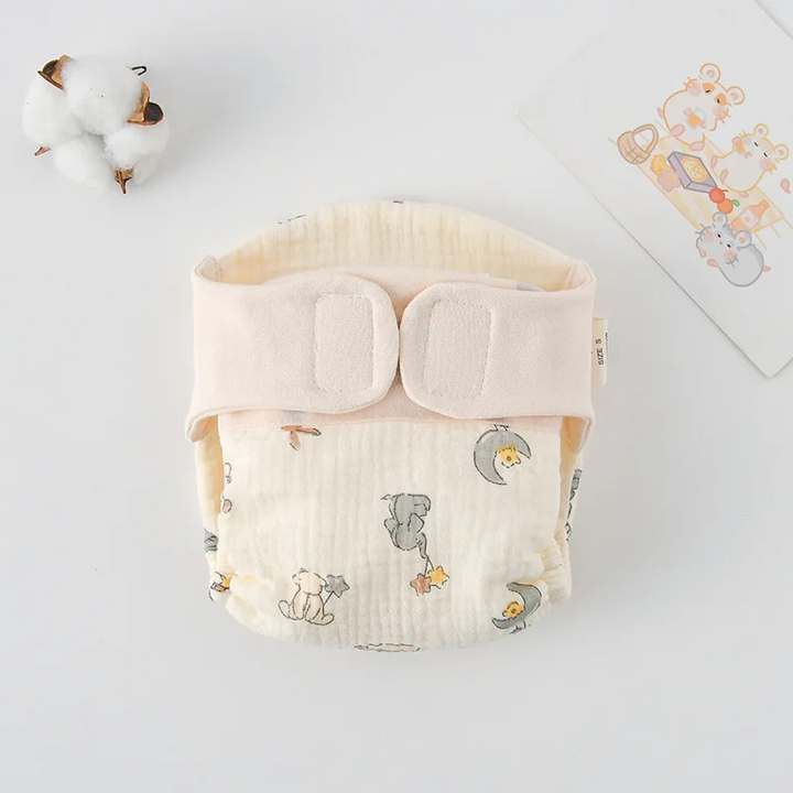 Cloth diaper with space-themed animal illustrations and a cream waistband