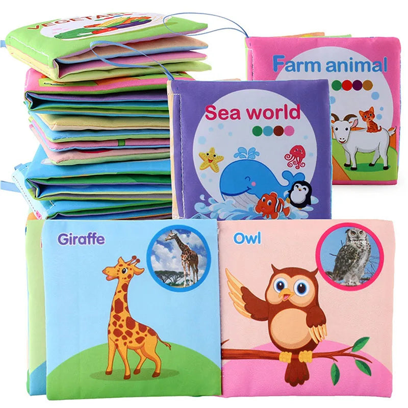 Stacked square fabric books with an open giraffe-and-owl spread and ocean and farm covers.