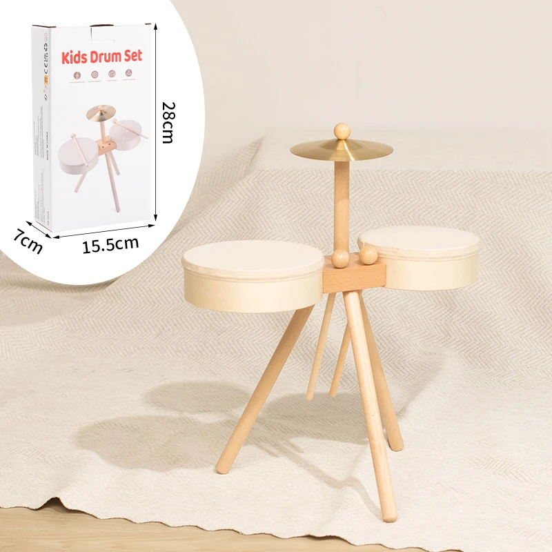 Wooden drum set without a bass drum beside a diagram showing box dimensions