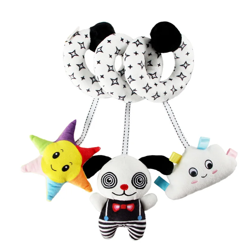 Black-and-white star-pattern spiral toy with a colorful star, animal figure, and smiling cloud.
