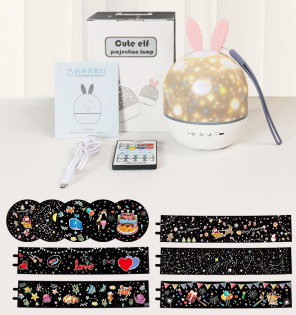 Star projector set with six projection films, USB cable, remote control, and packaging