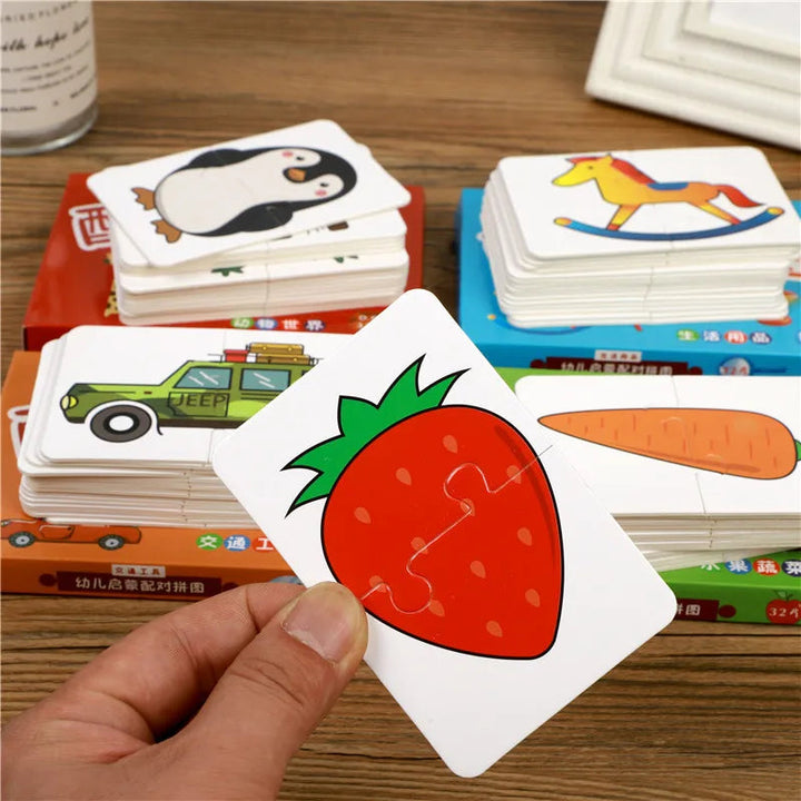 Hand holding a strawberry puzzle card in front of stacks of themed picture cards