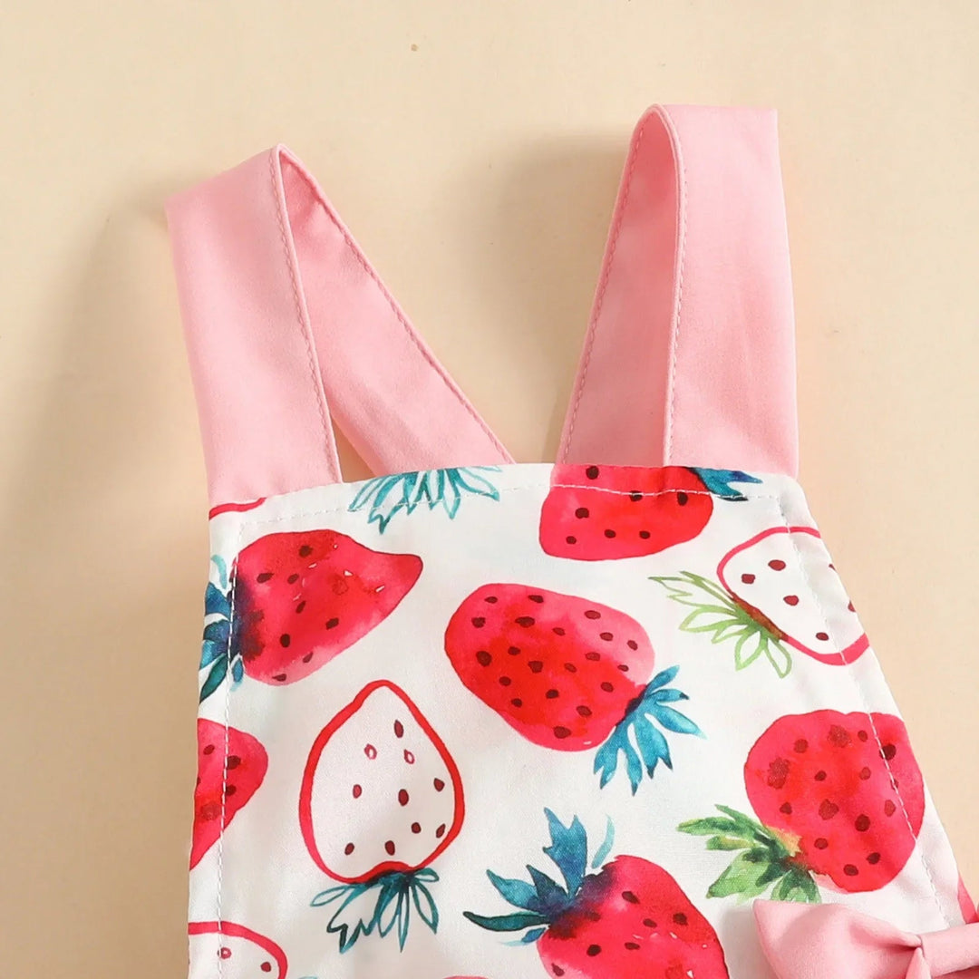 Close-up of the strawberry-print romper&