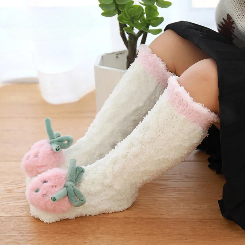 White strawberry long socks with pink cuffs worn up the legs