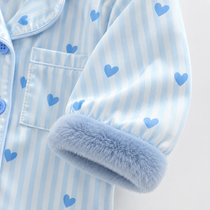 Blue plush wrist cuff and heart-print striped sleeve beside the jumpsuit&
