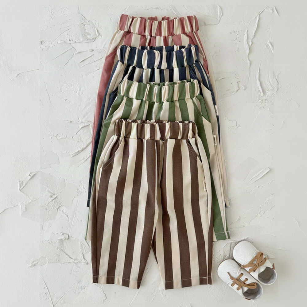 Pink, blue, green and brown striped baby pants hanging together