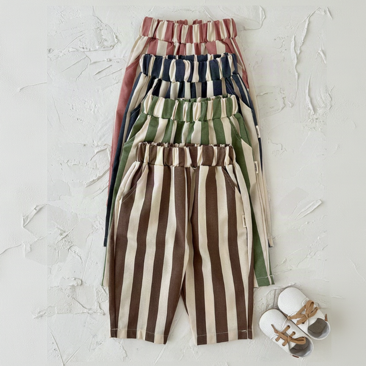 Pink, blue, green and brown striped baby pants hanging together