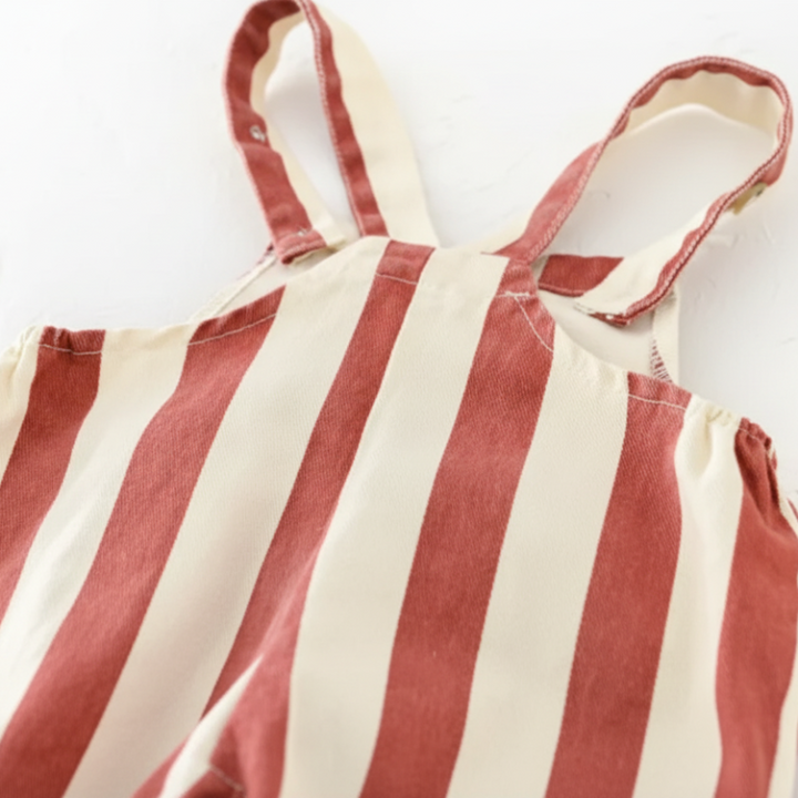 Close-up of the back and shoulder straps on the red striped overall romper