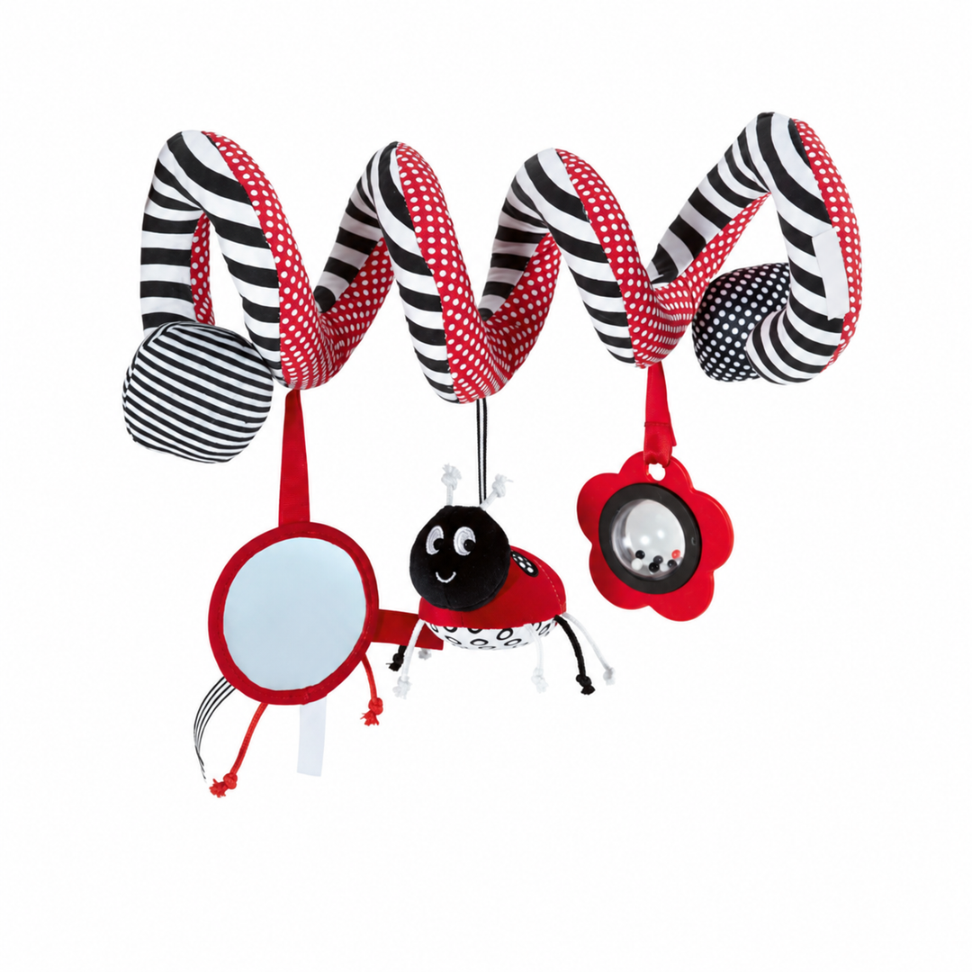 Black, white, and red striped spiral toy with hanging circular shapes and a ladybug.