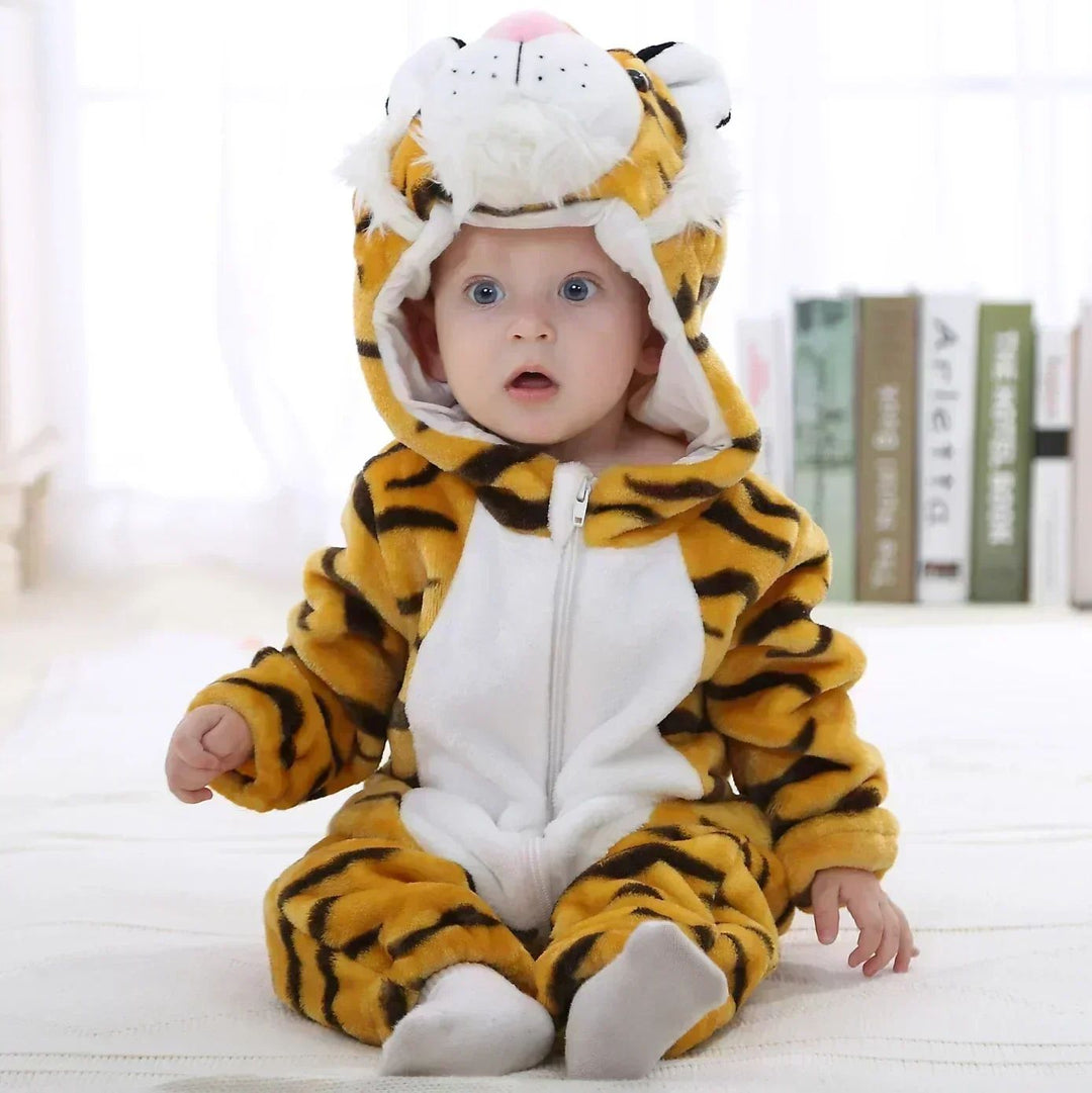 Baby wearing a golden tiger onesie with black stripes and a white belly