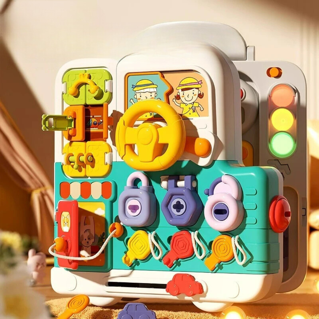 Suitcase-style busy board with a yellow steering wheel, colored locks, and traffic-light buttons