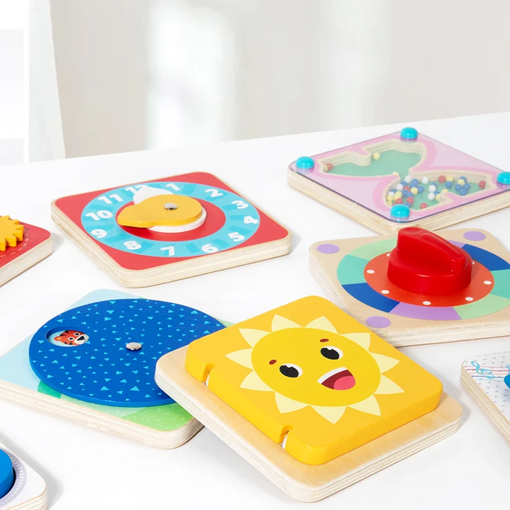 Sun-cover mirror board beside a clock, animal-matching wheel, turning dial, and hourglass bead board.