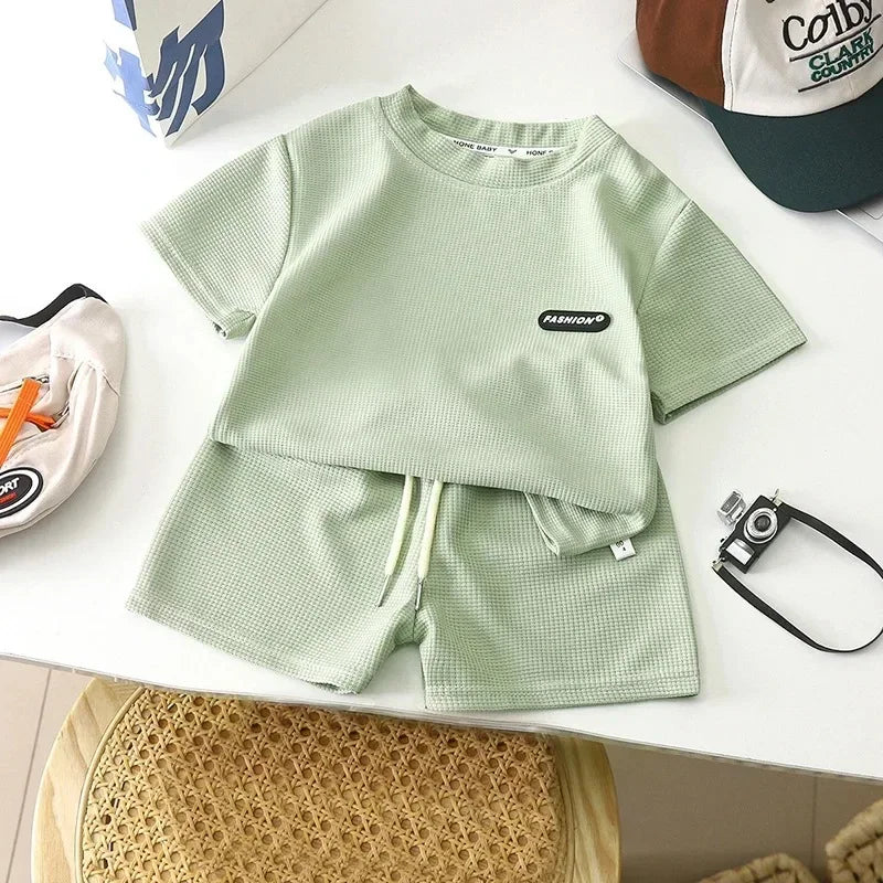 Green textured cotton T-shirt and matching shorts with an elastic waist and drawstring