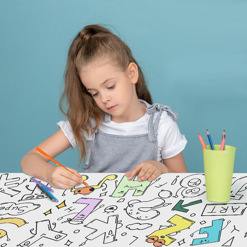 Child using colored pencils on a numbers-and-letters coloring sheet at a table