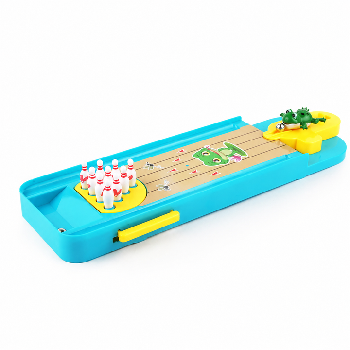 Full tabletop bowling lane with white pins at one end and a frog launcher at the other