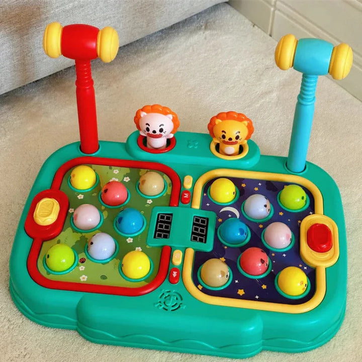 Two-player hammer game on a couch with upright hammers and colorful targets