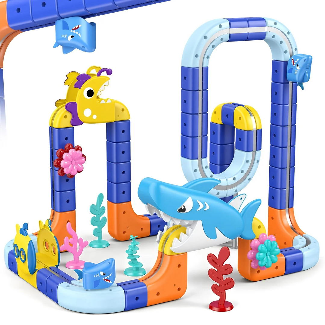 Tall ocean-themed train layout with a shark decoration, sea animals, and colorful coral