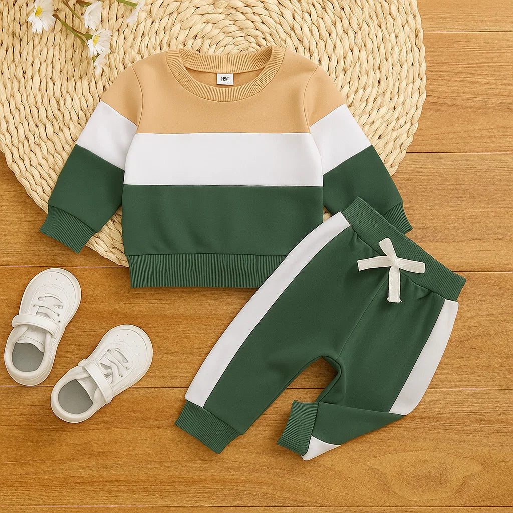 Tan, white and green sweatshirt beside green joggers with white side stripes