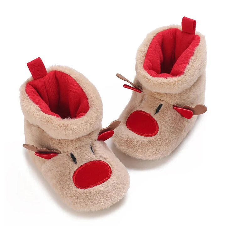 Pair of tan reindeer baby slippers viewed from above, showing red lining and heel pull tabs