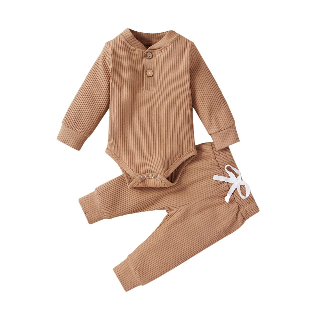 Tan ribbed baby bodysuit and matching pants with a white waist tie