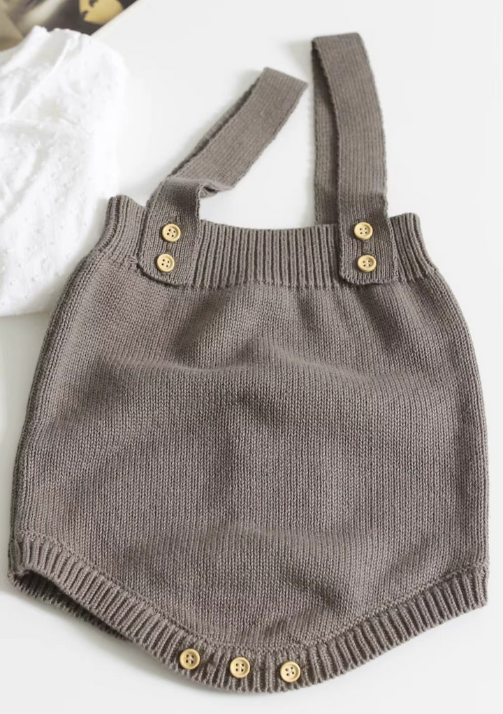 Taupe knit baby romper with buttoned shoulder straps and crotch buttons