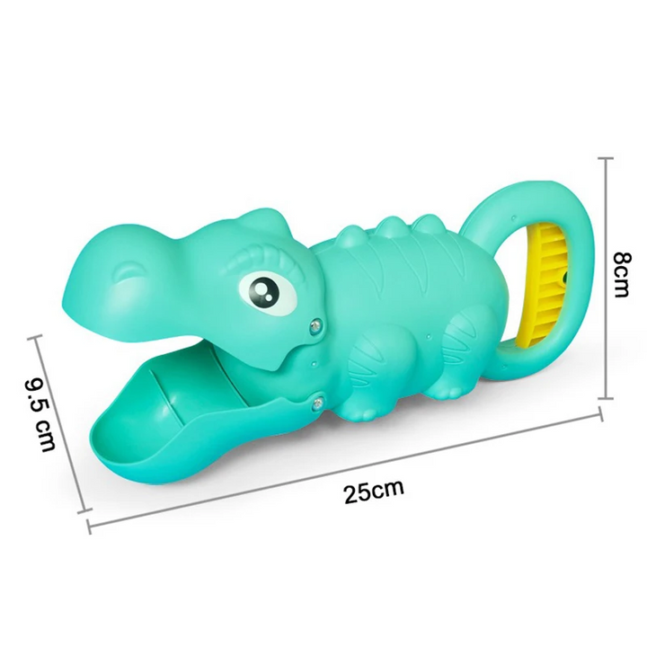 Teal dinosaur-shaped sand grabber measuring 25 x 8 x 9.5 cm