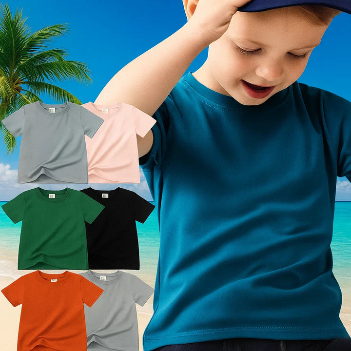 Boy wearing a teal short-sleeve T-shirt beside a selection of solid-color tees