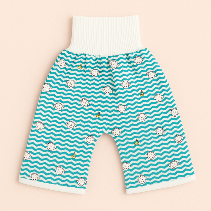 Teal and white zigzag monkey-print training pants with a ribbed waistband