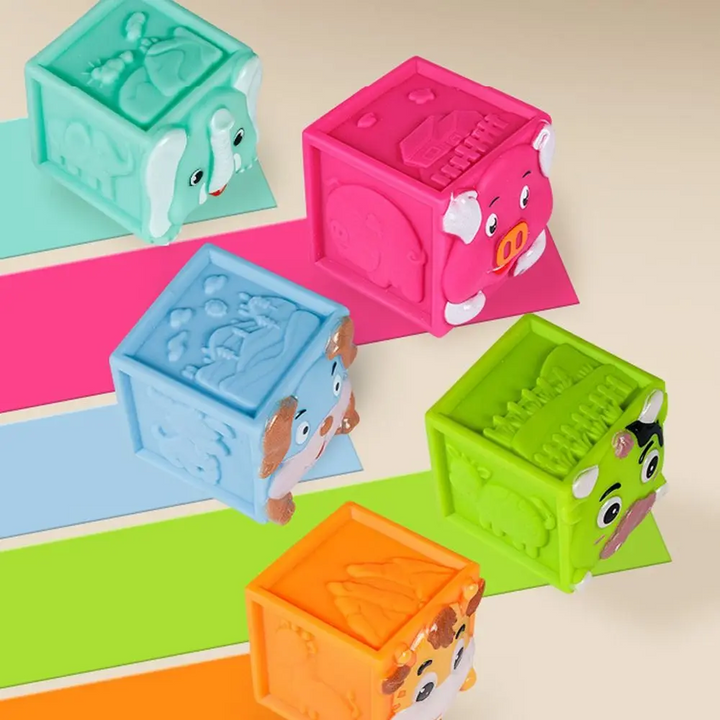Bright animal blocks with raised details on colorful stepped platforms