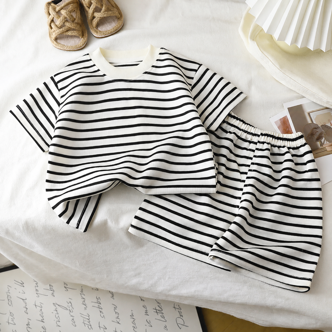 White T-shirt and matching shorts with thin black stripes and an elastic waistband.