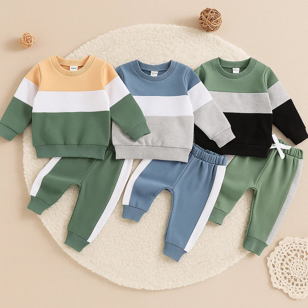 Three baby sweatshirt and jogger sets in tan and green, blue and gray, and green and black