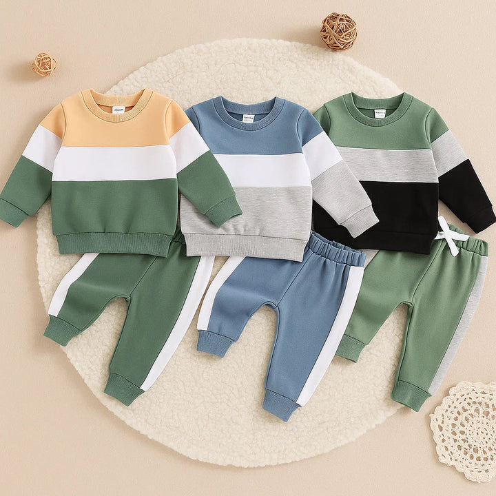 Three baby sweatshirt and jogger sets in tan and green, blue and gray, and green and black